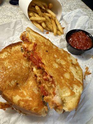 Chicken Parmesan melt with regular size fries and extra marinara sauce for dipping.