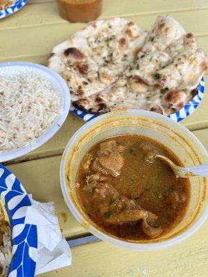 Chicken curry and garlic naan bread.