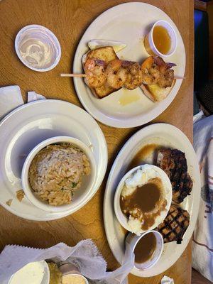 Pork chops and shrimp with rice and mashed potato