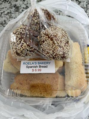 Oversized donut holes and Spanish bread.