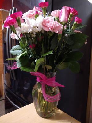 Lots of carnations with half empty vase