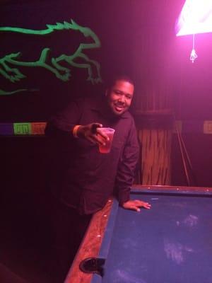 Me by a pool table