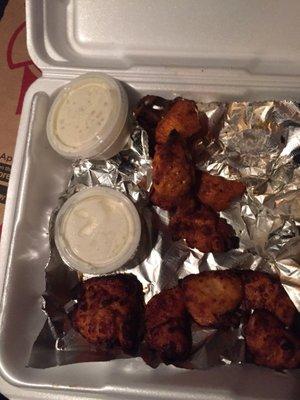 Boneless chicken wings- spicy barbecue on the bottom and hot on top