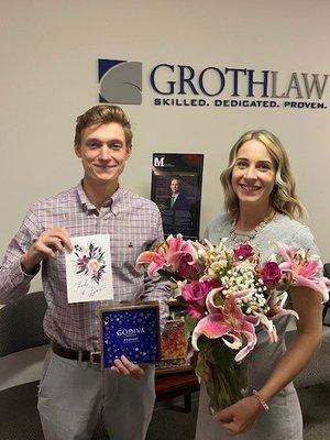 Katie and Attorney Mitch with gifts from a past client!