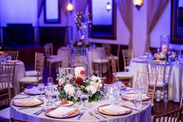 Alternated tables had a big candle pillar with florals and fairy lights