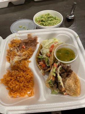 Steak taco dinner with side of green sauce and side of Guacamole!