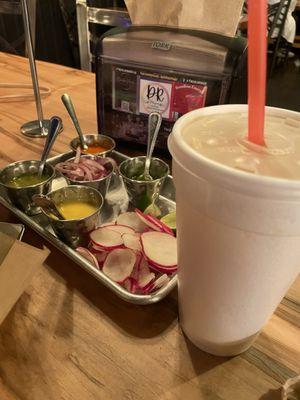 4 salsas: mango habanero, guacamole, verde (green) and roja (red), radishes and seasoned onions. Maracuya fruit drink (passion fruit).