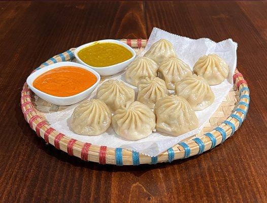 Steamed Momo served either with jhol achar or cilantro achar.