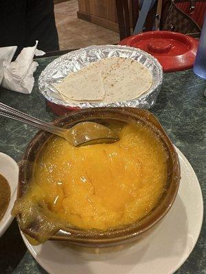 "Queso Fundido" that was literally just a bowl of microwave melted Kraft shredded cheese and store bought stale tortillas