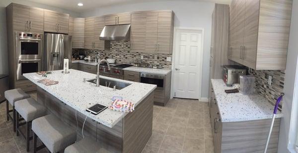 please disregard the random stuff on the counters. but beautiful cabinets and tile from pius!