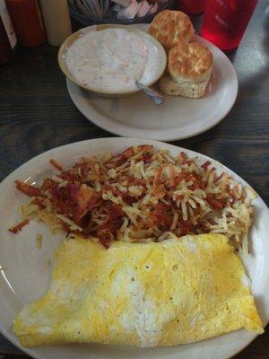 3 egg omelette with hash browns and biscuits and gravy.