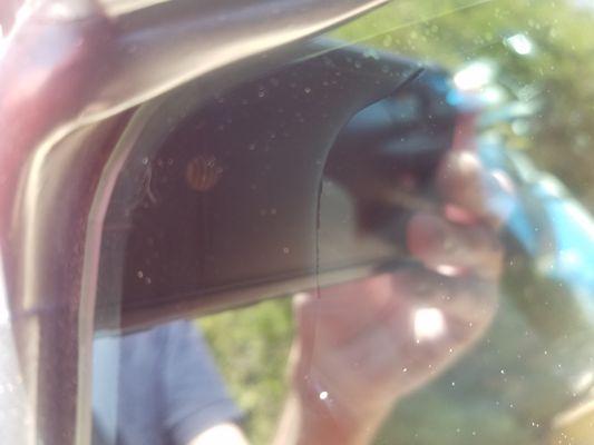 Passenger window. Bubbles, trash under.