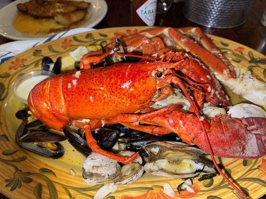 Large Clam Bake; steamed lobster, shrimp, clams, mussels and steamers in wine and garlic sauce. Different angles