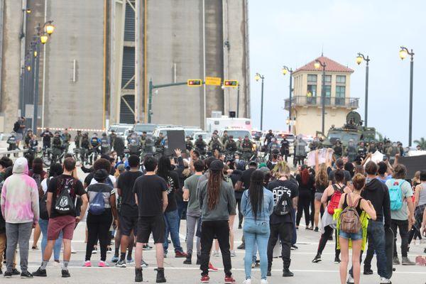 Protesters and police on the bridge.