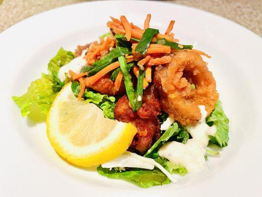 Definitely toss your own salad with their Karaage chicken, calamari squid, or other deli options.