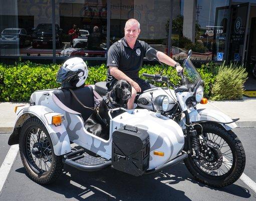 CEO and Founder Ken Wahlster with the shop dog, Chase, on Chase's Ural.  Crazy Russian-made 2WD machine!