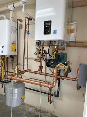 replaced two 80 gallon tank water heaters with new efficient Navien Tankless water heaters