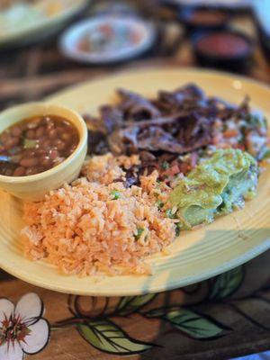 Steak fajita plate with charro beans