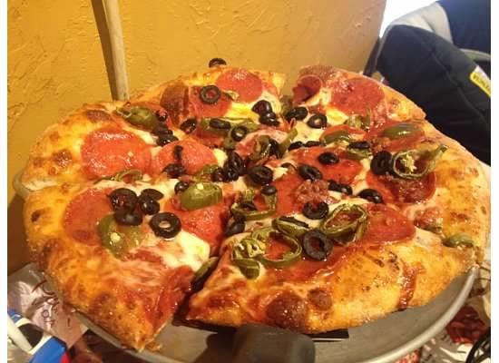 Pepperoni, Jalapanos, black olives, and bacon