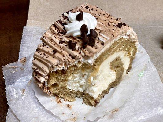 Cappuccino cake slice after a bite