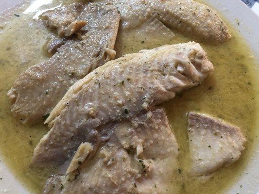 Tilapia with garlic sauce.