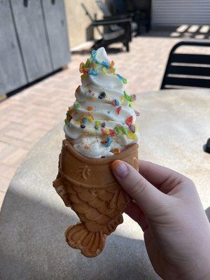 Taiyaki Cone with Vanilla Soft Serve topped with Fruity Peebles and Sweetened Condensed Milk.