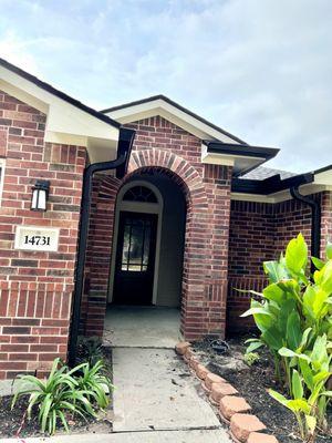 My front door and beautiful new Kustom Gutters in black!  These are 6 inch size.