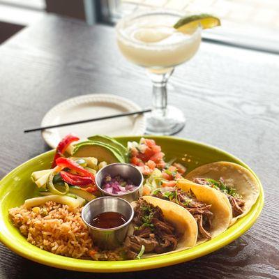 Carnitas tacos and a frozen margarita.