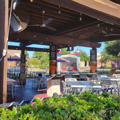 Outdoor seating and a bouncy house for the kiddos