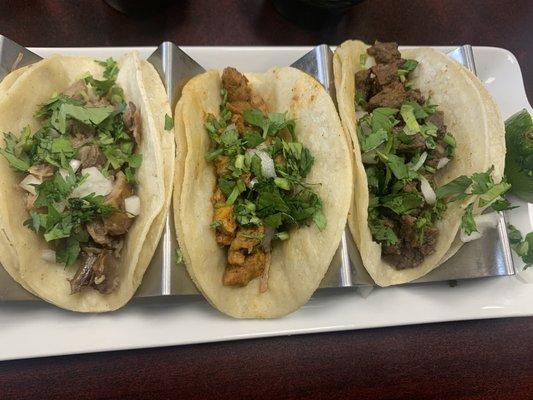 L to R: carnitas, al pastor, carne asada