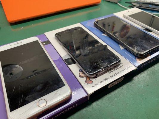 Several iPhones lined up for repair