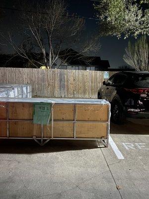 1 single pallet intentionally placed in the forefront of a useable parking spot