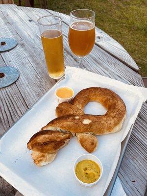 Beer pretzel, shaped like Mortal Key logo, served with incredible grain mustard and savory cheese sauce.