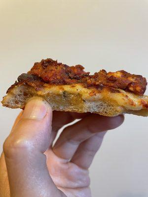 Sliced side of Meatball on top of a White Slice