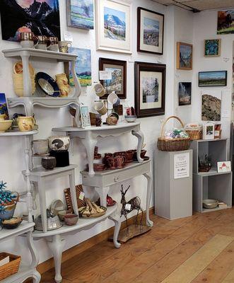 Our unique shelving created from vintage tables to showcase Wyoming Art and Gifts!