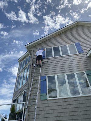 Painting Shutters on beautiful Samish Island home.