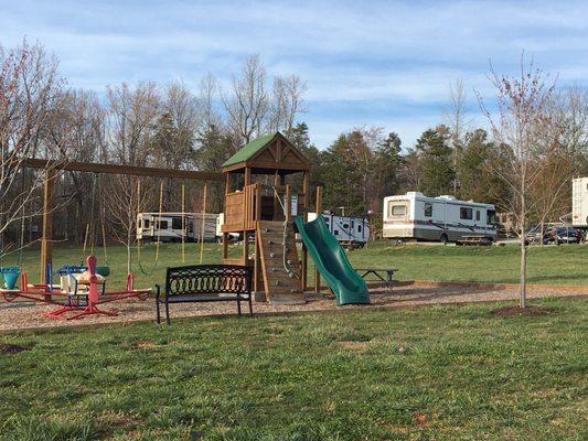 Nice open front lawn and playground.