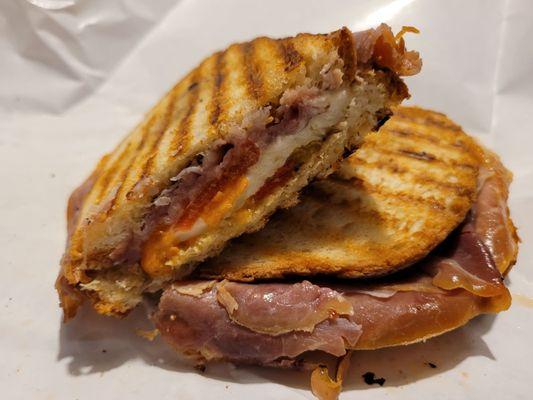 Serino panini.  Proscuitto, fresh mozz ,roasted peppers, tomato, and Serino dressing. A favorite.