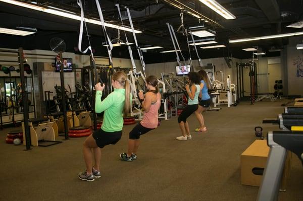 Girls strengthening their posture during small group training.