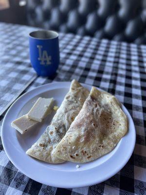 Tradicional baleadas! Baleadas Sencillas... it's just flour tortillas w fried beans sour cream and cheese w a hot cup of coffee