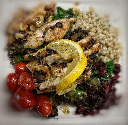 The bowl ; roasted kale , Craisins, couscous , walnuts .. lemon Dill vinaigrette with optional grilled chicken