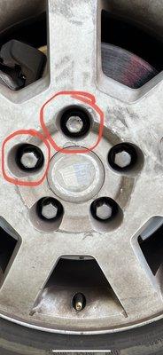 They damaged those two lug nuts that are circled. The owner claimed the lug nuts are no good. But 3 out of 5 seemed to work well.