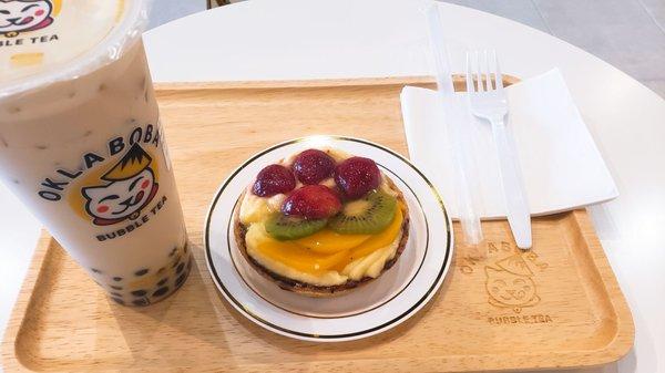 Large house milk tea w/ regular ice & 50% sugar with a fruit tart.