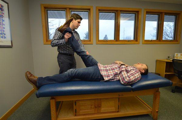 Dr. Rowe giving a chiropractic examination