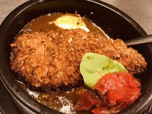 Baked Katsu curry rice. Japanese style curry with panko breaded pork cutlet and egg.