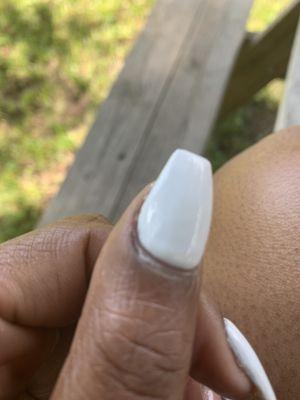 Gap in between my nail and the paint. It also is not flat and the paint is chipping on the sides.