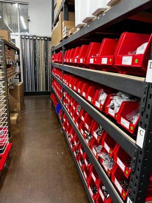 Blum Concealed Hinges in red bins