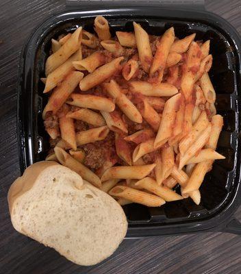 Penne with meatballs, bread.