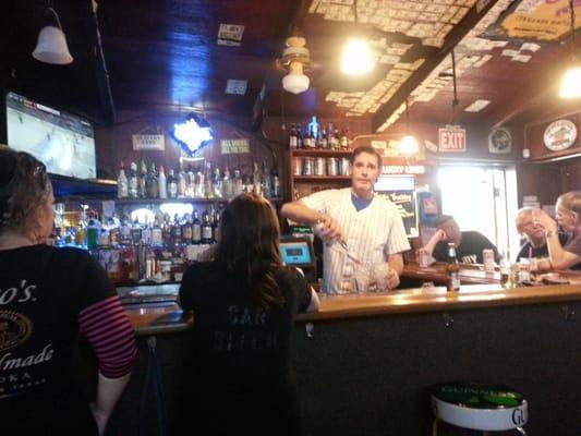 Danny is tending bar. The ladies all love Danny.