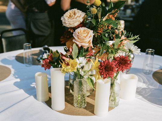 bud vases and bridesmaid bouquet centerpiece